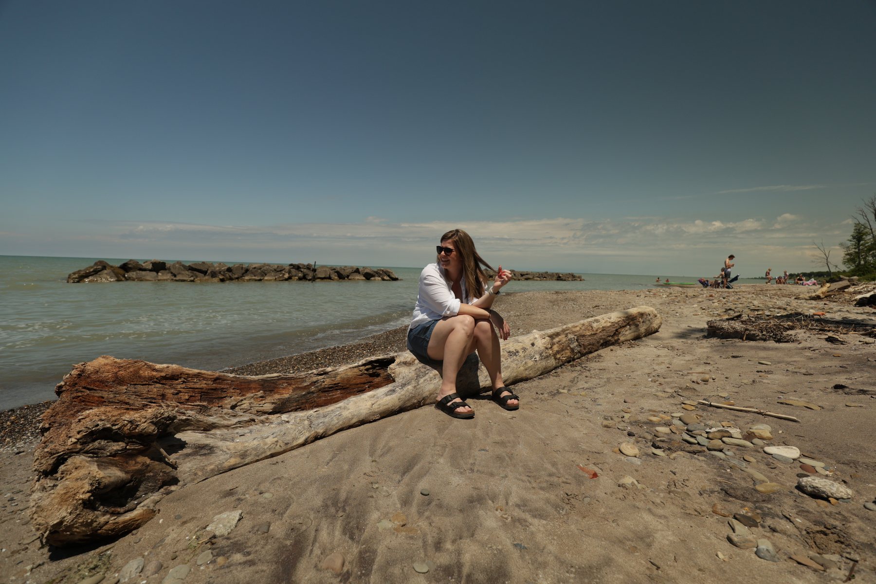 Relaxed portrait moment on a rocky beach.