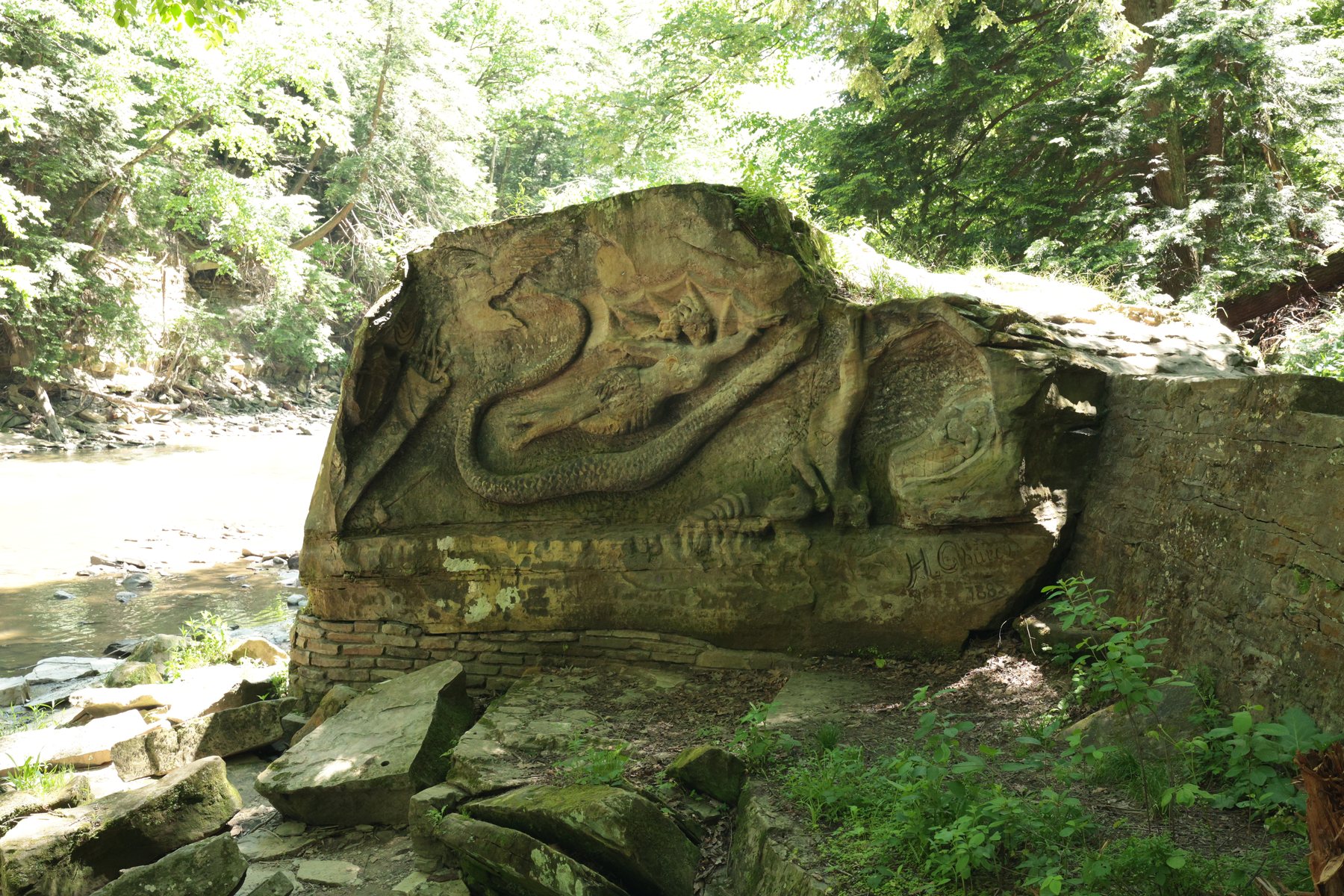 Stone detail along a wooded creek.