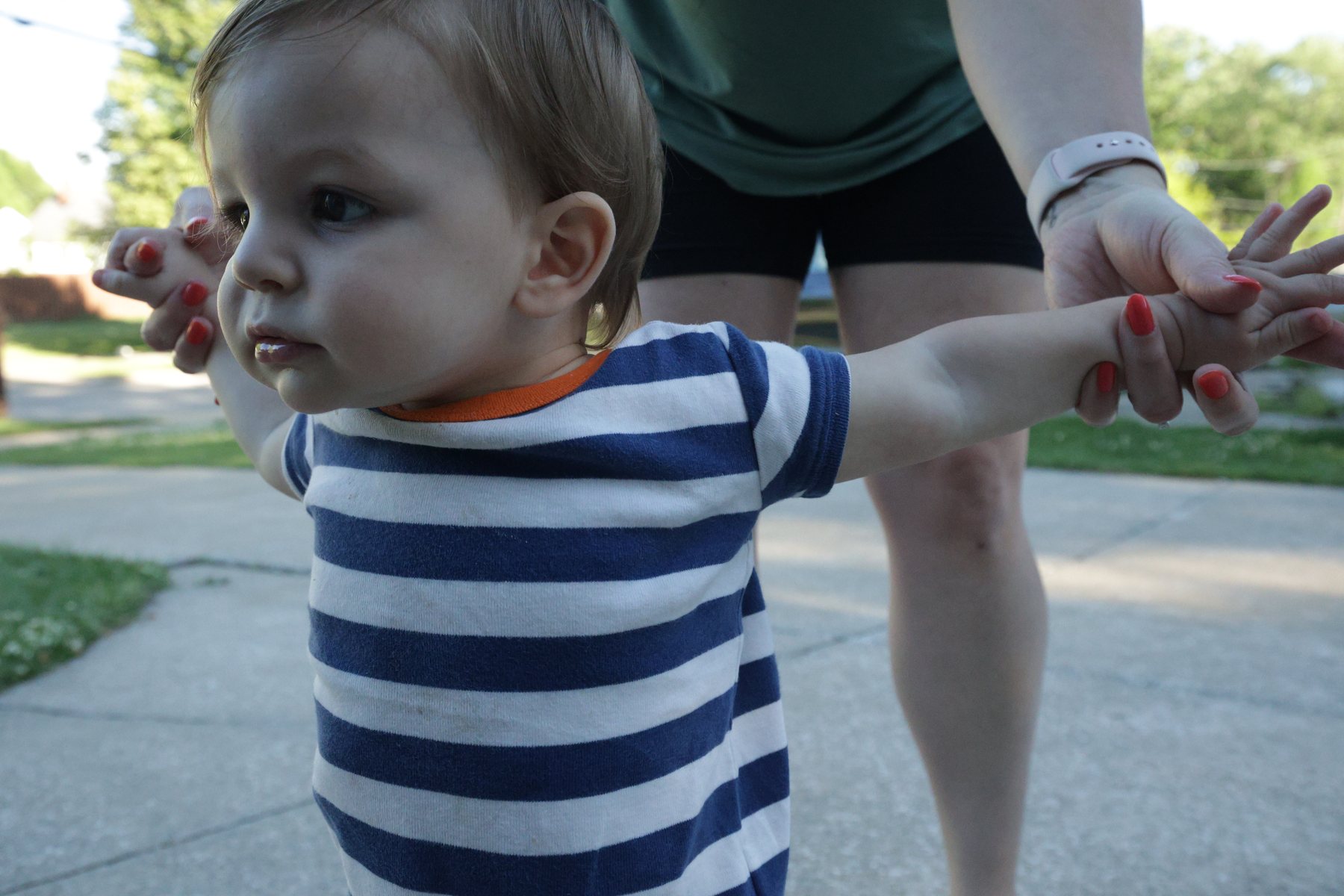 Young child in a candid outdoor family moment.
